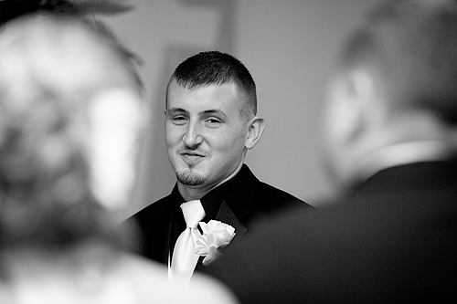 groom smiling when seeing bride