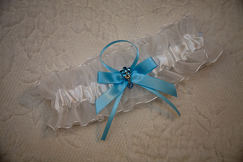 bride's garter with blue ribbon 