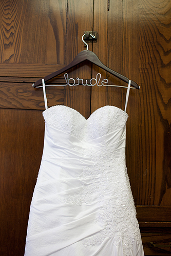 wedding dress with bride hanger