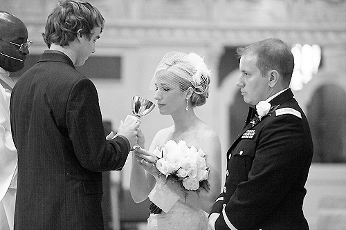 bride and groom receiving communion during mass